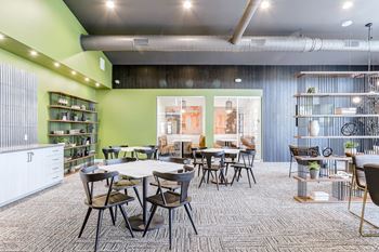 a dining room with tables and chairs and a library
